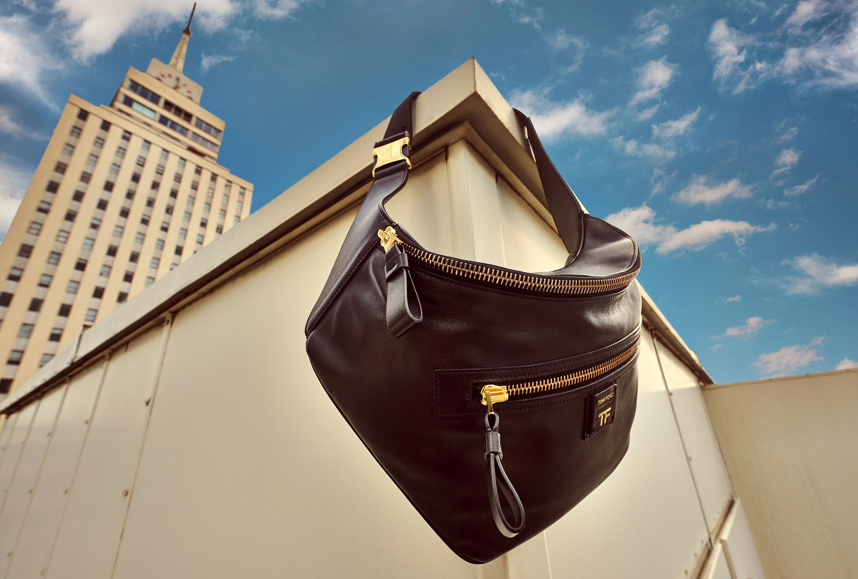 Downtown rooftop photographs of luxury shoes and handbags by pho