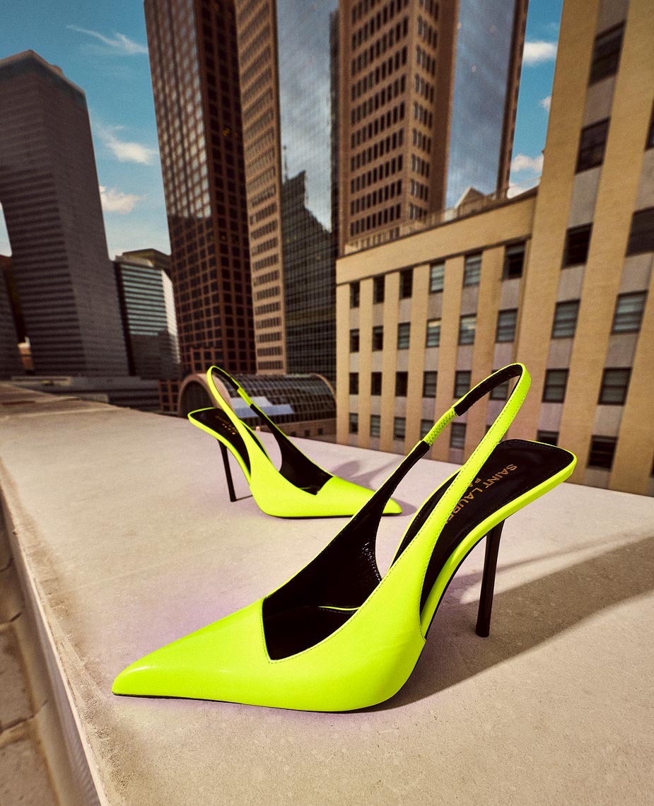 Downtown rooftop photographs of luxury shoes and handbags by pho