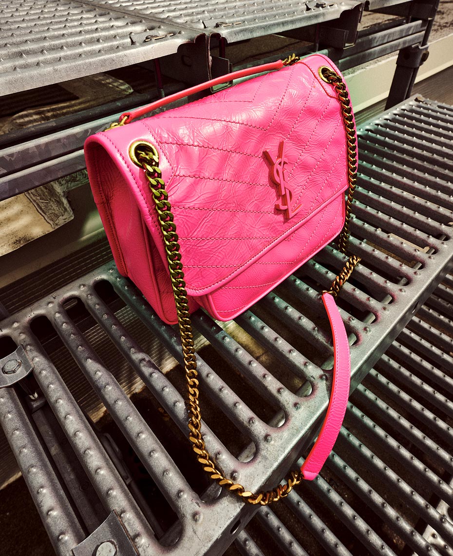 Downtown rooftop photographs of luxury shoes and handbags by pho